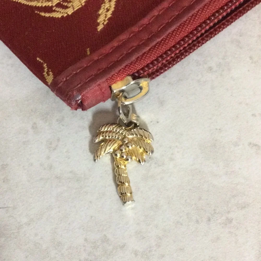 Celebrity Gold Palm-Print Pouch in Burgundy